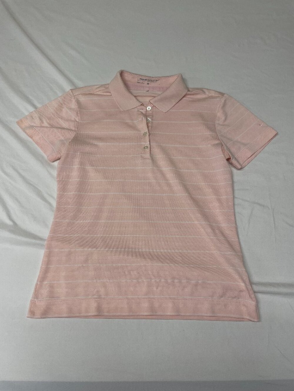 Pink and white striped golf shirt